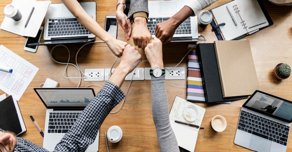 colleagues fist bumping over digital transformation