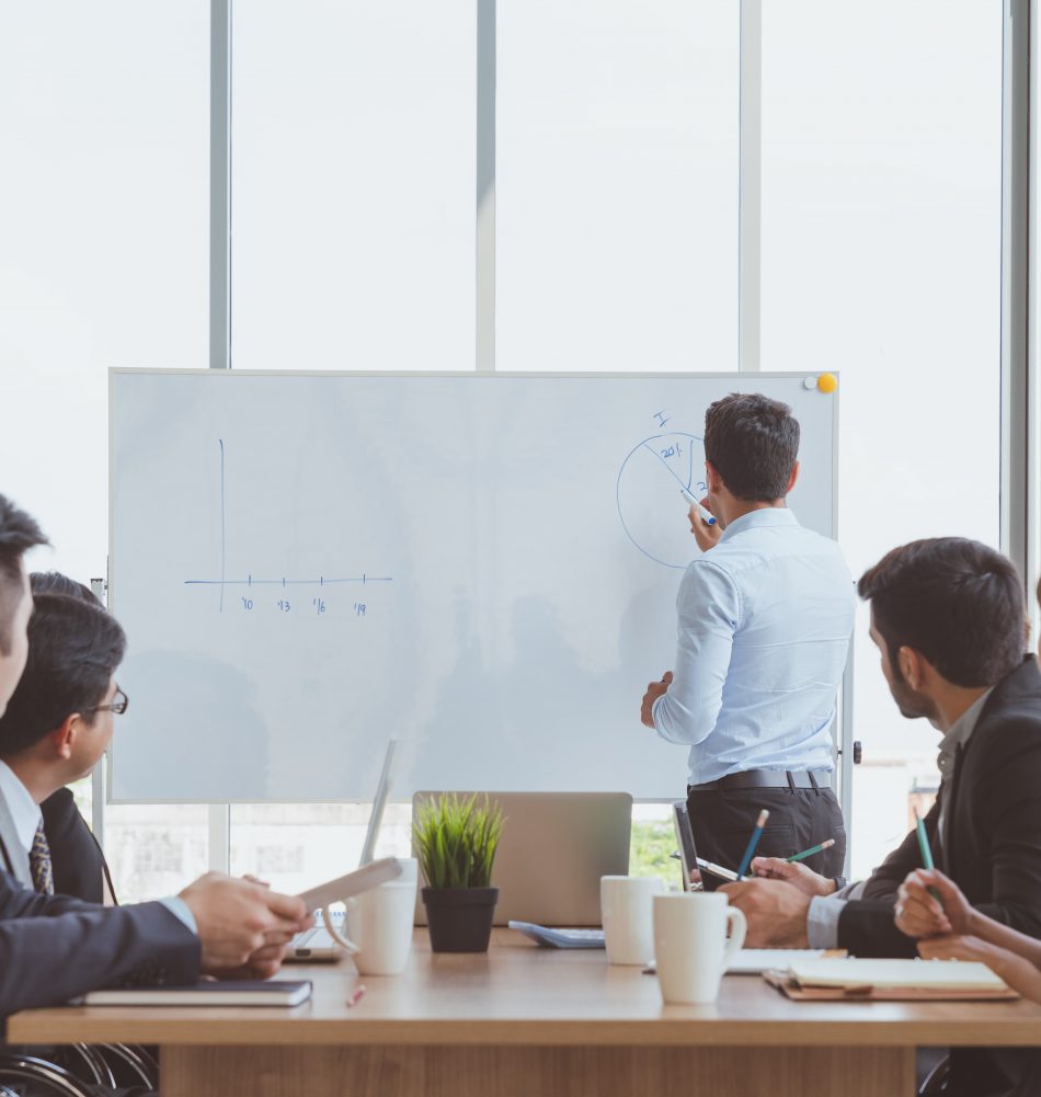 businessman-leader-writing-whiteboard-present-business-marketing-graph-while-meeting-with-colleagues-office-business-team-meeting-presentation-conference-planning-business-concept (1) businessman-leader-writing-whiteboard-present-business-marketing-graph-while-meeting-with-colleagues-office-business-team-meeting-presentation-conference-planning-business-concept (1)