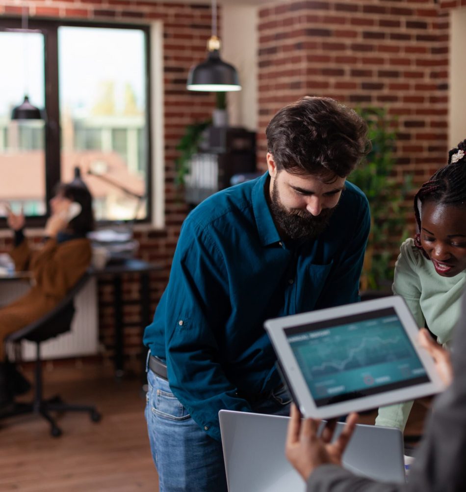 multiracial-businesspeople-holding-tablet-computer-with-marketing-turnover-screen-working-company-project-discussing-business-strategy-working-startup-office-diverse-team-brainstorming-ideas (1) multiracial-businesspeople-holding-tablet-computer-with-marketing-turnover-screen-working-company-project-discussing-business-strategy-working-startup-office-diverse-team-brainstorming-ideas (1)